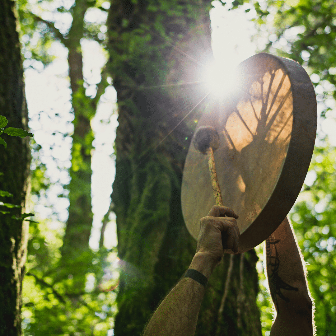 Shamanic drum held in a forest